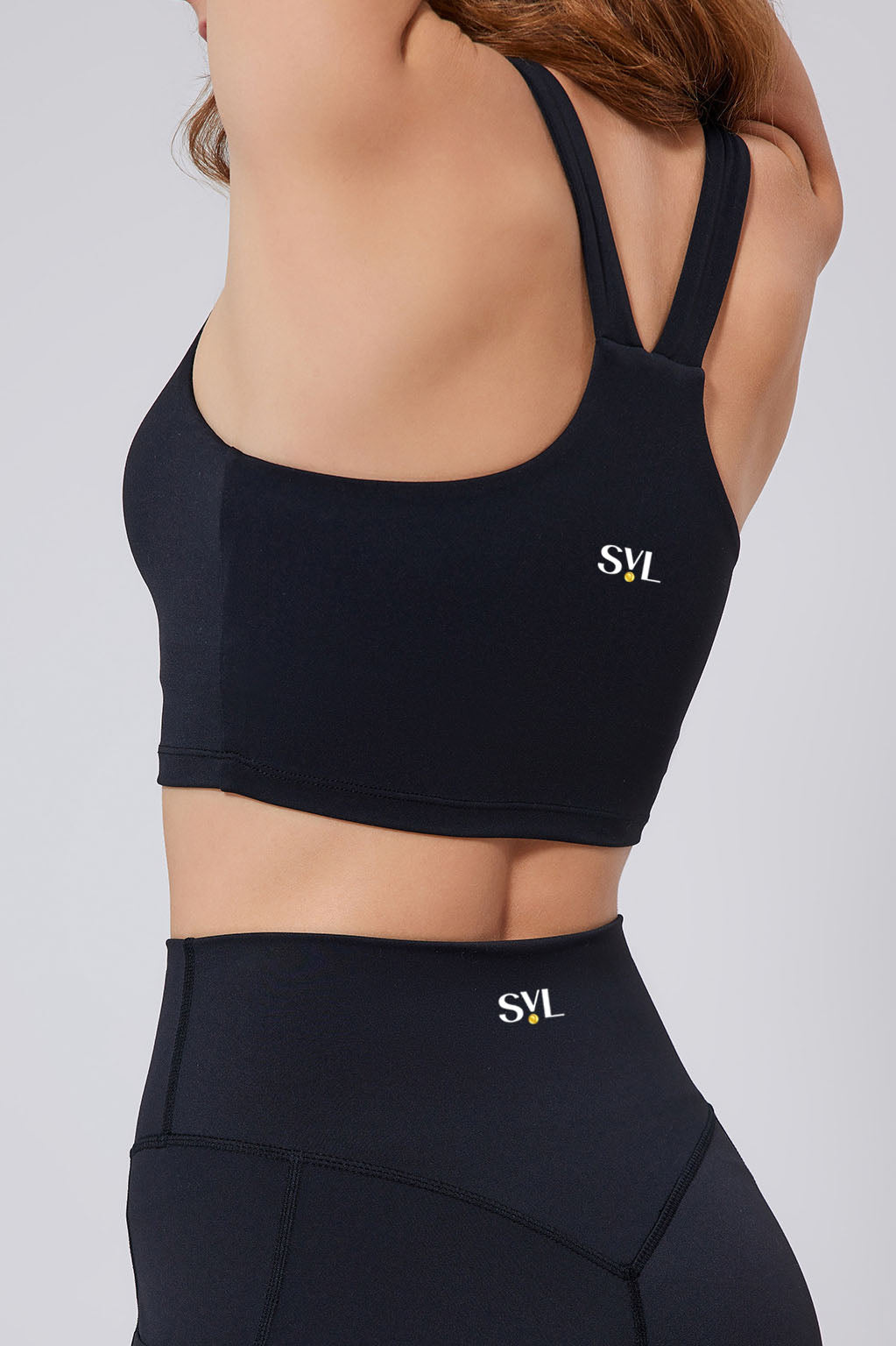 SVL Padel Active Aura Bra in black, designed with a supportive racerback, moisture-wicking fabric, and a snug fit to ensure comfort during intense padel sessions