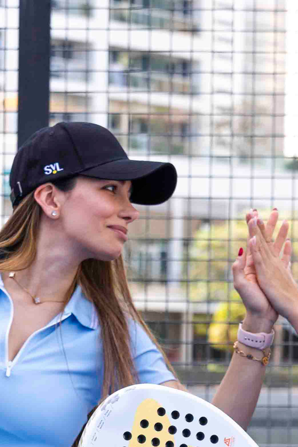 SVL Padel Classic Cap in black, featuring an adjustable strap, curved brim, and embroidered logo, providing stylish sun protection during outdoor padel matches