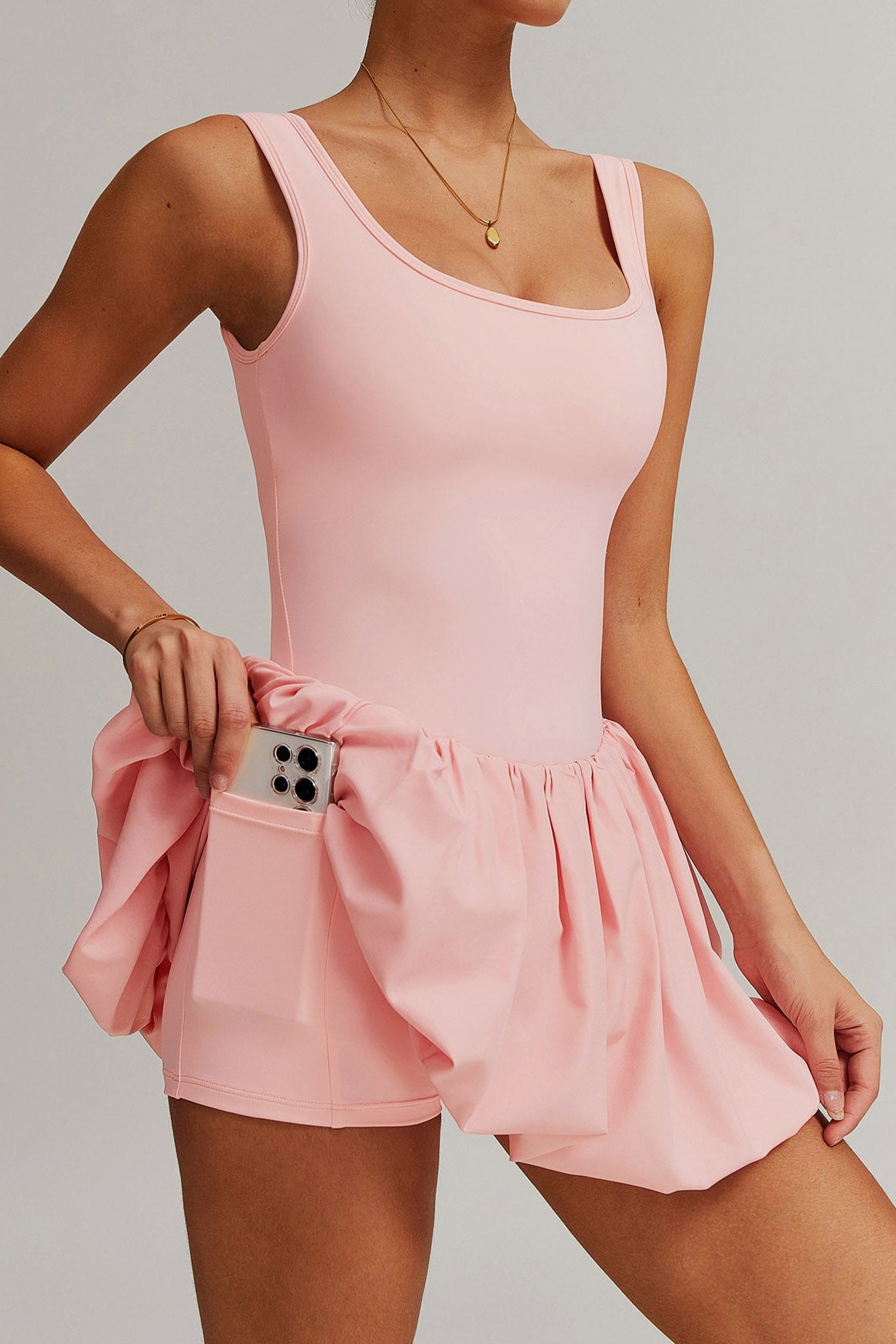 SVL Padel Bubble Belle Dress in pink, designed with a playful bubble hem, moisture-wicking fabric, and built-in shorts for stylish performance during padel matches