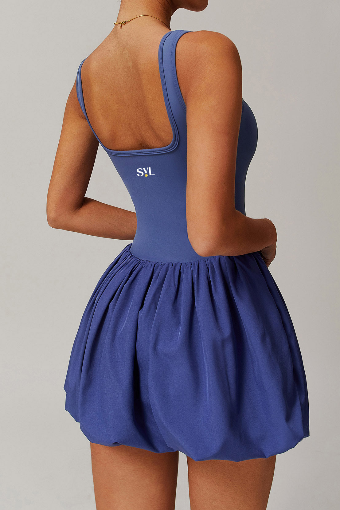 SVL Padel Bubble Belle Dress in royal blue, designed with a playful bubble hem, moisture-wicking fabric, and built-in shorts for stylish performance during padel matches