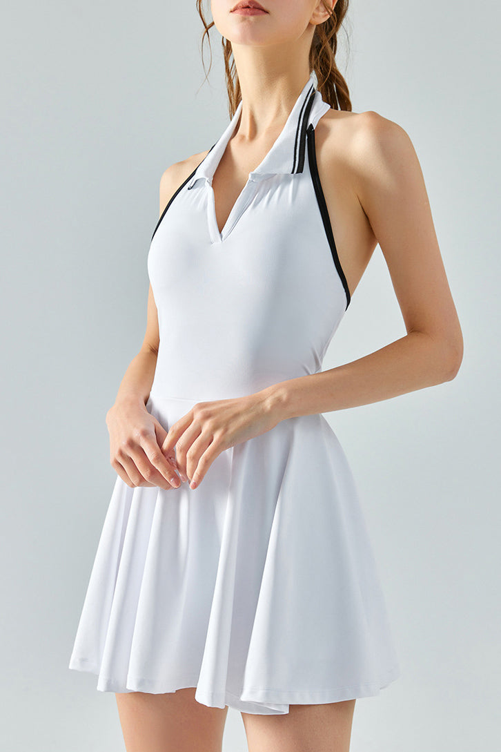 SVL Padel Perfect Polo Dress in white, designed with a classic polo collar, breathable fabric, and built-in shorts, ideal for a polished look on the padel court