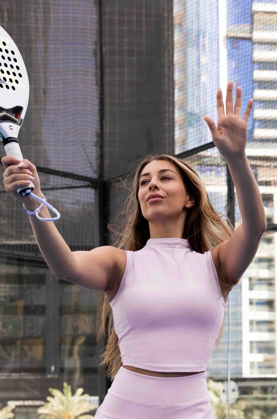 SVL Padel Swan Sway Set in Pink – a graceful and performance-focused ensemble featuring a sleeveless, high-neck top paired with a flared skirt with built-in shorts. Designed for elegance, comfort, and agility, this set is crafted from lightweight, breathable fabric with an elastic waistband, ensuring effortless movement and style on the padel court