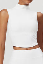 SVL Padel Swan Sway Set in White – a graceful and performance-focused ensemble featuring a sleeveless, high-neck top paired with a flared skirt with built-in shorts. Designed for elegance, comfort, and agility, this set is crafted from lightweight, breathable fabric with an elastic waistband, ensuring effortless movement and style on the padel court