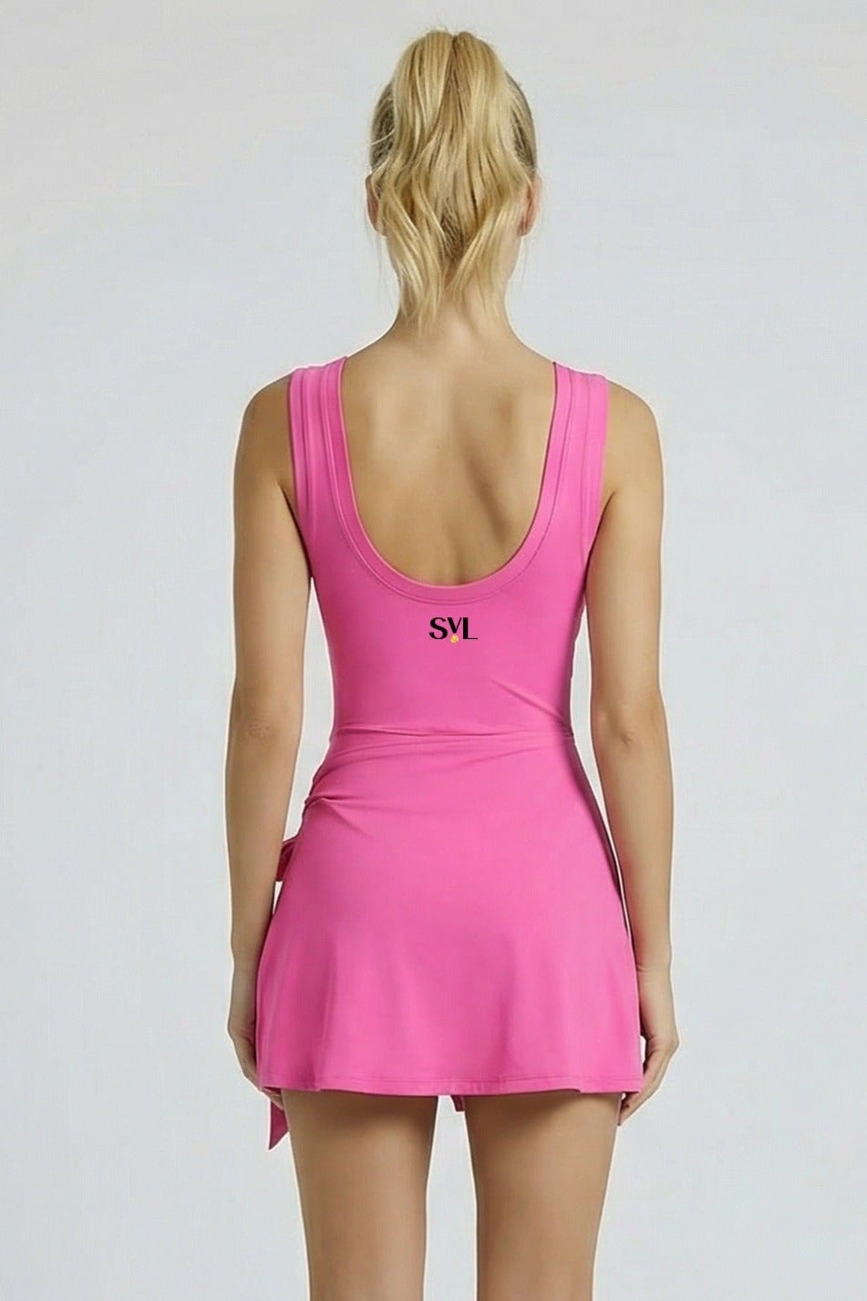 Back view of SVL fuchsia pink padel and tennis dress Play and Party athletic performance dress for women
