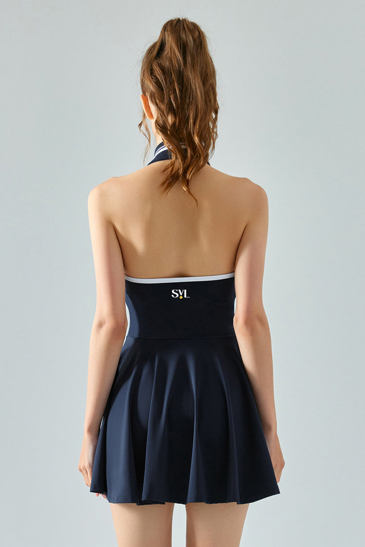Back view of SVL navy blue tennis and padel dress Perfect Polo flared performance dress for women