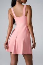 SVL Padel Sweet Swirl Dress in pink, showcasing a swirling pattern, comfortable fit, and built-in shorts, perfect for both padel games and casual outings