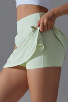 SVL Padel Ace & Allure Skirt in soft green, featuring a flared design with built-in shorts and 2 pockets, perfect for dynamic movements on the padel court