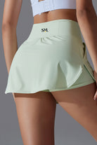 SVL Padel Ace & Allure Skirt in soft green, featuring a flared design with built-in shorts and 2 pockets, perfect for dynamic movements on the padel court