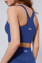 SVL Padel Active Aura Bra in dark blue, designed with a supportive racerback, moisture-wicking fabric, and a snug fit to ensure comfort during intense padel sessions