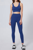 SVL Padel Active Aura Bra in dark blue, designed with a supportive racerback, moisture-wicking fabric, and a snug fit to ensure comfort during intense padel sessions
