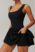 SVL Padel Bubble Belle Dress in black, designed with a playful bubble hem, moisture-wicking fabric, and built-in shorts for stylish performance during padel matches