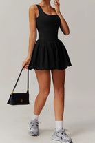 SVL Padel Bubble Belle Dress in black, designed with a playful bubble hem, moisture-wicking fabric, and built-in shorts for stylish performance during padel matches