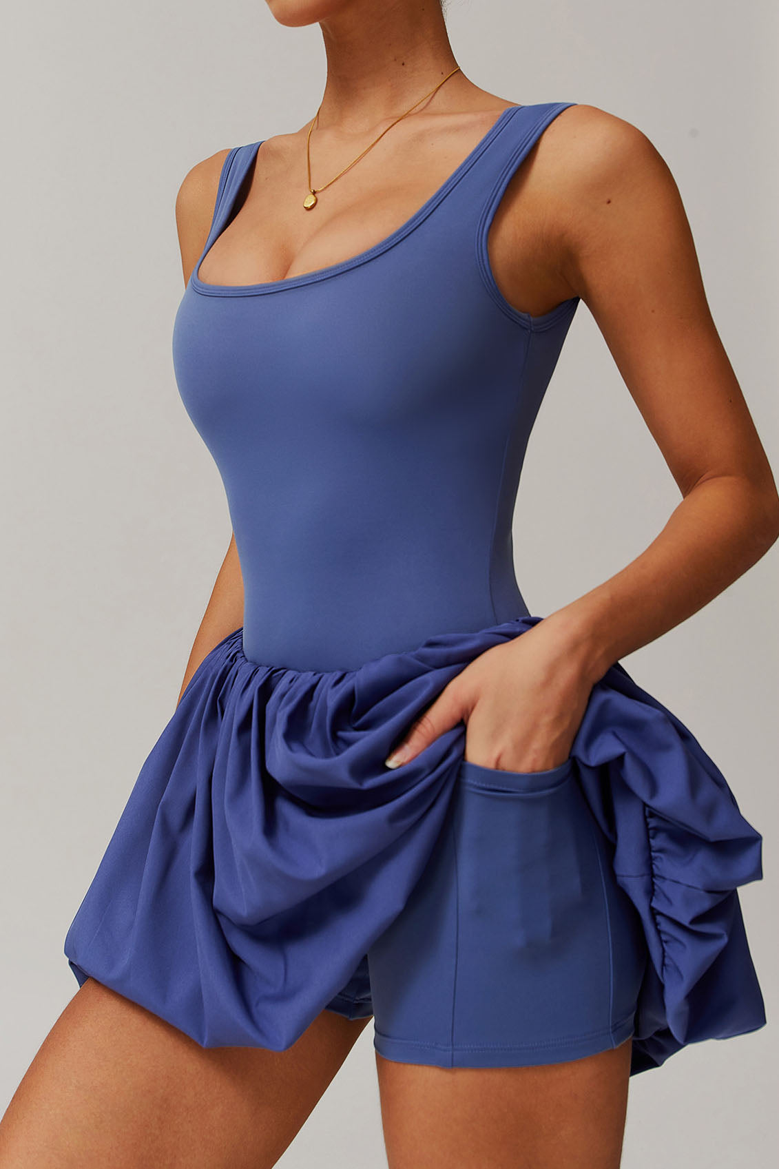 SVL Padel Bubble Belle Dress in royal blue, designed with a playful bubble hem, moisture-wicking fabric, and built-in shorts for stylish performance during padel matches