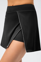 SVL Padel Court & Confidence Skirt in black, designed with a streamlined fit, built-in shorts, and stretch fabric, ensuring confidence and freedom of movement on the padel court