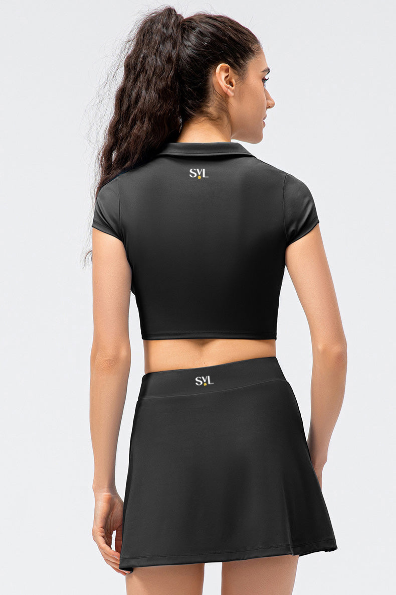 SVL Padel Court & Confidence Set in Black – a sleek and performance-driven ensemble featuring a fitted, moisture-wicking top paired with a streamlined skirt with built-in shorts. Designed for competitive padel play, this set offers a perfect blend of comfort, style, and stretch fabric to ensure confidence and freedom of movement on the court