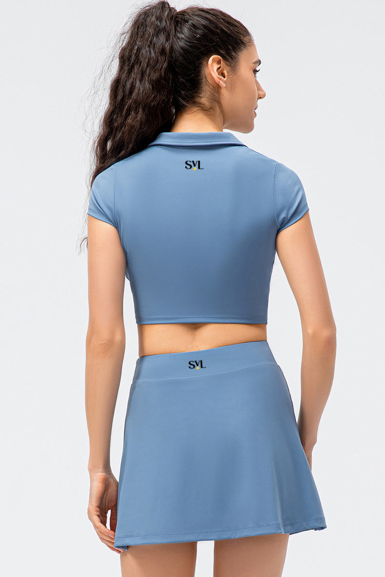 SVL Padel Court & Confidence Set in Serene Blue – a sleek and performance-driven ensemble featuring a fitted, moisture-wicking top paired with a streamlined skirt with built-in shorts. Designed for competitive padel play, this set offers a perfect blend of comfort, style, and stretch fabric to ensure confidence and freedom of movement on the court
