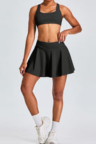 SVL Padel Featherlight & Flow Skirt in black, offering a flowy silhouette with built-in shorts, constructed from breathable fabric for optimal performance during padel matches