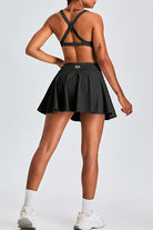 SVL Padel Featherlight & Flow Skirt in black, offering a flowy silhouette with built-in shorts, constructed from breathable fabric for optimal performance during padel matches