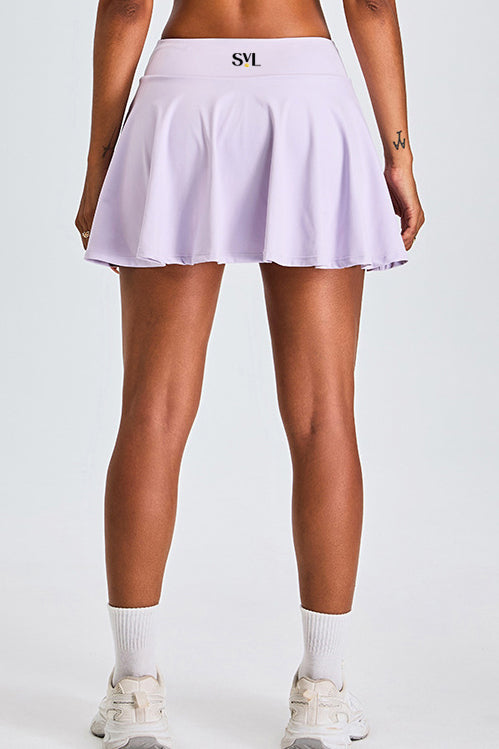 SVL Padel Featherlight & Flow Skirt in lavender, offering a flowy silhouette with built-in shorts, constructed from breathable fabric for optimal performance during padel matches