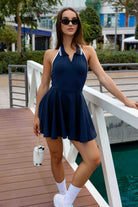 SVL Padel Perfect Polo Dress in dark blue, designed with a classic polo collar, breathable fabric, and built-in shorts, ideal for a polished look on the padel court