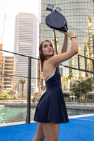 SVL Padel Perfect Polo Dress in dark blue, designed with a classic polo collar, breathable fabric, and built-in shorts, ideal for a polished look on the padel court