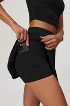 SVL Padel Plush Pleat Set in Black – a stylish and performance-driven outfit featuring a pleated skirt with built-in shorts and a matching top with a squared neckline. Crafted from lightweight, soft-touch fabric, this set ensures breathability, comfort, and unrestricted movement, making it the perfect choice for padel players who want to play in style.