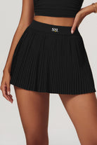 SVL Padel Plush Pleat Set in Black – a stylish and performance-driven outfit featuring a pleated skirt with built-in shorts and a matching top with a squared neckline. Crafted from lightweight, soft-touch fabric, this set ensures breathability, comfort, and unrestricted movement, making it the perfect choice for padel players who want to play in style.