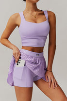 SVL Padel Plush Pleat Set in Lavender – a stylish and performance-driven outfit featuring a pleated skirt with built-in shorts and a matching top with a squared neckline. Crafted from lightweight, soft-touch fabric, this set ensures breathability, comfort, and unrestricted movement, making it the perfect choice for padel players who want to play in style.