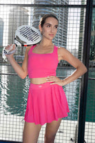 SVL Padel Plush Pleat Set in Magenta – a stylish and performance-driven outfit featuring a pleated skirt with built-in shorts and a matching top with a squared neckline. Crafted from lightweight, soft-touch fabric, this set ensures breathability, comfort, and unrestricted movement, making it the perfect choice for padel players who want to play in style.