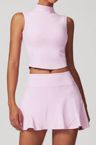 SVL Padel Swan Sway Set in Pink – a graceful and performance-focused ensemble featuring a sleeveless, high-neck top paired with a flared skirt with built-in shorts. Designed for elegance, comfort, and agility, this set is crafted from lightweight, breathable fabric with an elastic waistband, ensuring effortless movement and style on the padel court