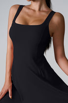 SVL Padel Sweet Swirl Dress in black, showcasing a swirling pattern, comfortable fit, and built-in shorts, perfect for both padel games and casual outings