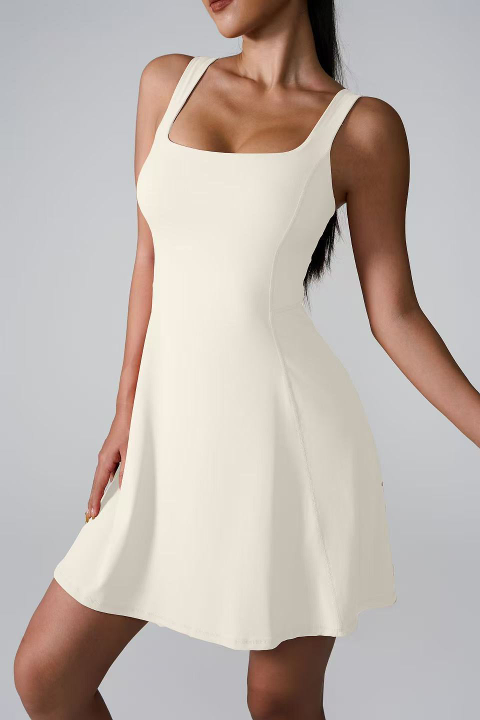 SVL Padel Sweet Swirl Dress in ivory, showcasing a swirling pattern, comfortable fit, and built-in shorts, perfect for both padel games and casual outings