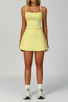 Full studio shot of a female padel and tennis player wearing the yellow SVL Anna padel skirt set for a complete athletic look.