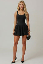 SVL black mini dress Bubble Belle styled for padel and tennis performance and night out