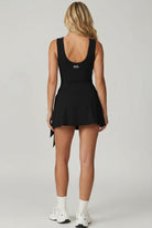Back view of SVL black padel and tennis dress Play and Party athletic performance dress for women