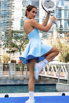 SVL blue tennis and padel dress Perfect Polo worn by female padel player on court