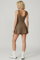 Back view of SVL brown mocha padel and tennis dress Play and Party athletic performance dress for women