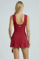 Back view of SVL burgundy red padel and tennis dress Play and Party athletic performance dress for women