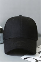Front view of SVL black unisex padel and tennis cap with structured design