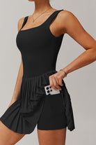 Close-up of the black Daria tennis dress highlighting the functional side pocket in the under-shorts for a phone or extra balls.