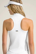 Rear view of the white SVL Kate top showcasing the athletic racerback design, SVL brand logo, and breathable performance fabric.