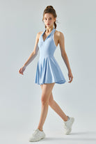 Full body view of SVL light blue padel and tennis dress Perfect Polo athletic performance dress for women