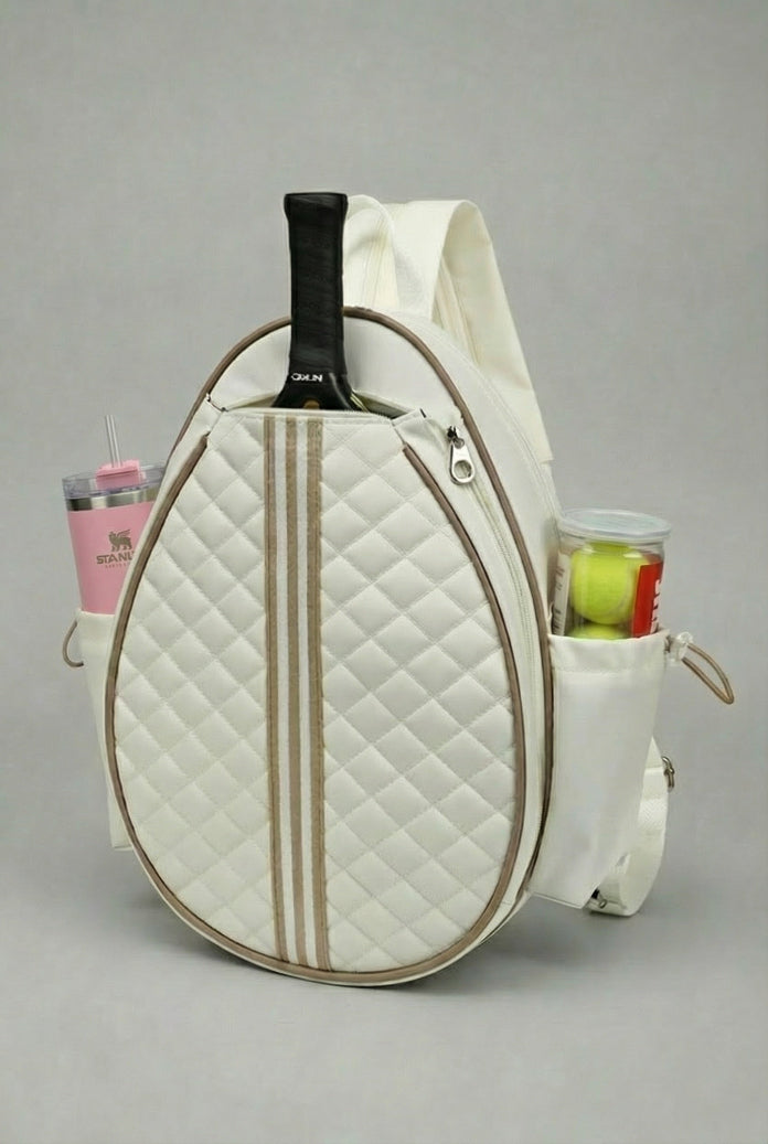 A premium white quilted SVL padel backpack featuring a dedicated racket compartment, side mesh pockets for a water bottle and padel balls, and adjustable straps.