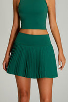 Close-up of SVL Maria Skirt in green, a pleated performance padel and tennis skirt for women