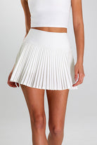 Close-up of SVL Maria Skirt in white, a pleated performance padel and tennis skirt for women