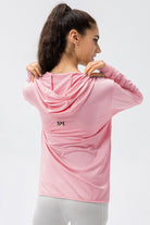 Rear view of the pink SVL Maya performance jacket showing the hood and the SVL brand logo on the upper back.