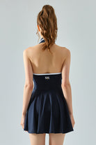 Back view of SVL navy blue tennis and padel dress Perfect Polo flared performance dress for women