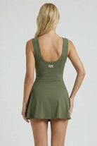 Back view of SVL olive green padel and tennis dress Play and Party athletic performance dress for women