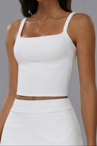 SVL Anna white padel and tennis top featuring a modern square neckline and supportive wide straps.