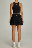 SVL Maria Skirt - a pleated black padel and tennis skirt for women